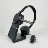Jabra Evolve 75 UC headset and charging stand side view showing busylight